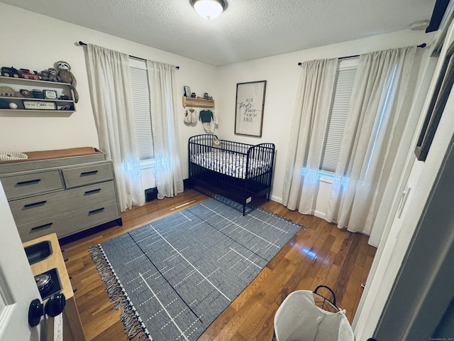 352 Knob Hill Dr, Hamden, CT 06518 - bedroom with hardwood / wood-style floors and a textured ceiling