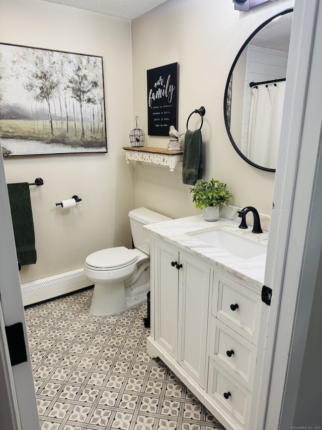 352 Knob Hill Dr, Hamden, CT 06518 - bathroom with a baseboard radiator and vanity