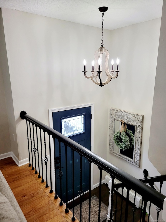 352 Knob Hill Dr, Hamden, CT 06518 - staircase with a chandelier and wood finished floors