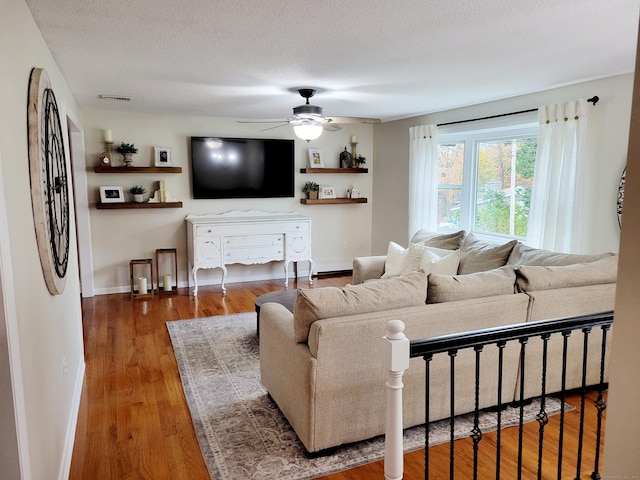 352 Knob Hill Dr, Hamden, CT 06518 - living area with ceiling fan, wood finished floors, and a textured ceiling