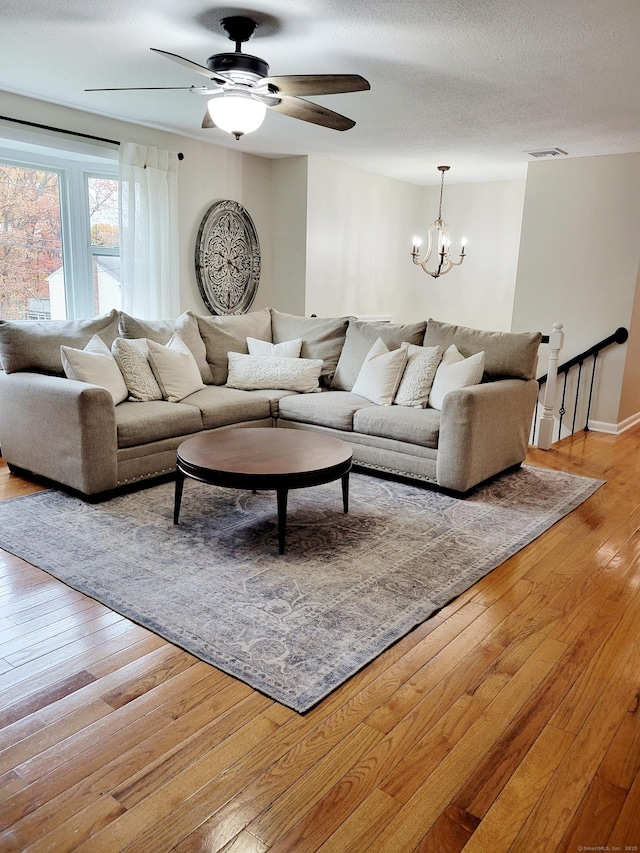 352 Knob Hill Dr, Hamden, CT 06518 - living room featuring light wood-style flooring, a chandelier, and a ceiling fan