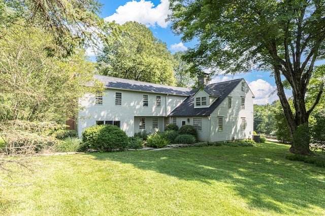 85 Potash Hill Rd, Sprague, CT 06330 - back of property with a yard and a chimney