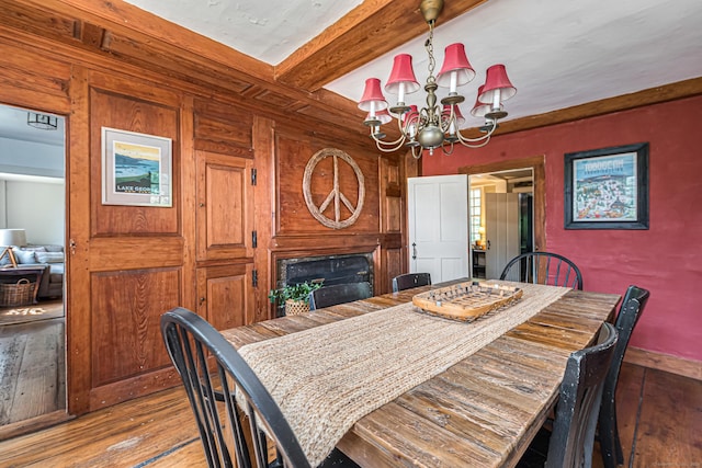 85 Potash Hill Rd, Sprague, CT 06330 - dining room with wood-type flooring, a chandelier, a fireplace, and beam ceiling