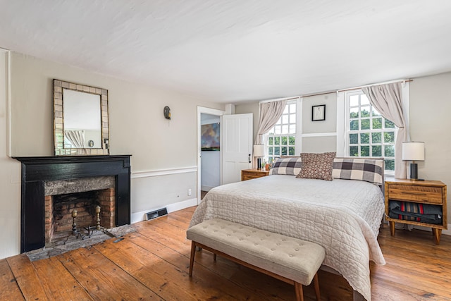 85 Potash Hill Rd, Sprague, CT 06330 - bedroom with hardwood / wood-style floors and a fireplace