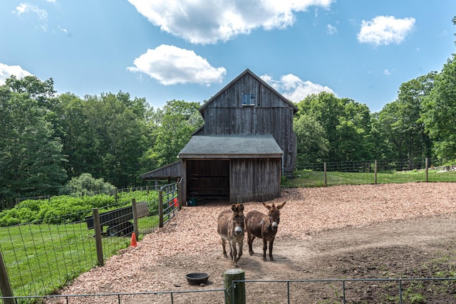 85 Potash Hill Rd, Sprague, CT 06330 - view of barn featuring an exterior structure and a wooded view