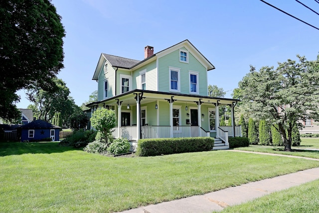 30 Elizabeth St, Bethel, CT 06801 - view of front of property with covered porch, a chimney, and a front yard