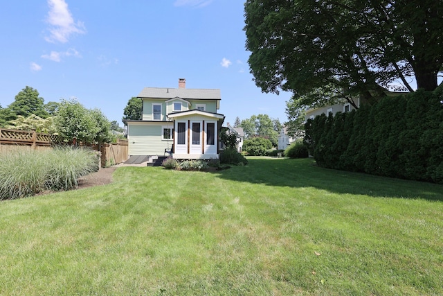30 Elizabeth St, Bethel, CT 06801 - rear view of property featuring a chimney