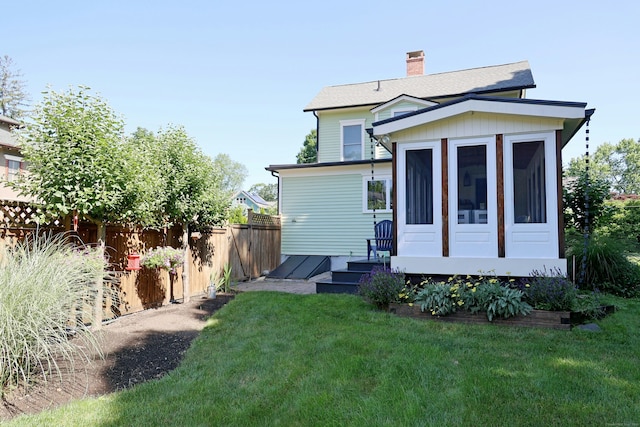 30 Elizabeth St, Bethel, CT 06801 - back of property with a sunroom and a chimney