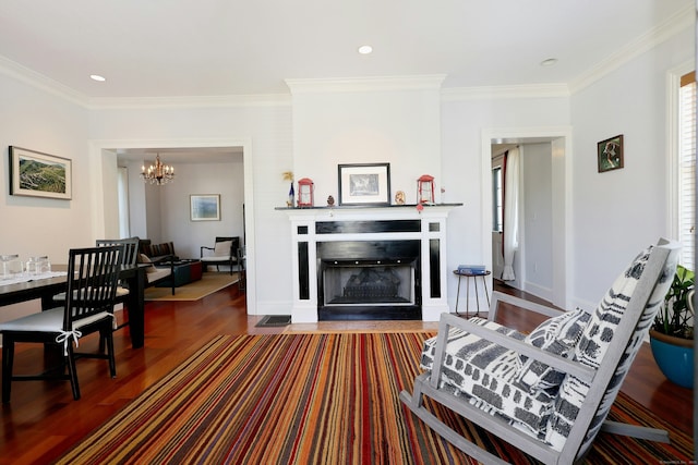 30 Elizabeth St, Bethel, CT 06801 - living room with dark wood-style floors, a chandelier, a fireplace with flush hearth, crown molding, and recessed lighting