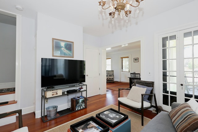 30 Elizabeth St, Bethel, CT 06801 - living area with wood finished floors, french doors, and a chandelier