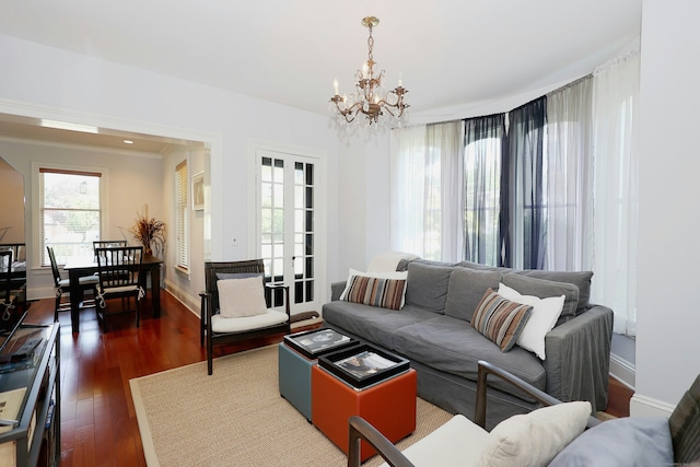30 Elizabeth St, Bethel, CT 06801 - living room with plenty of natural light, a chandelier, and dark wood-style flooring