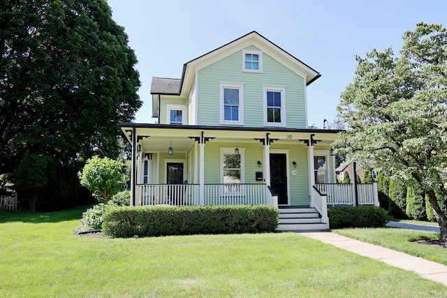 30 Elizabeth St, Bethel, CT 06801 - view of front of house with covered porch and a front lawn
