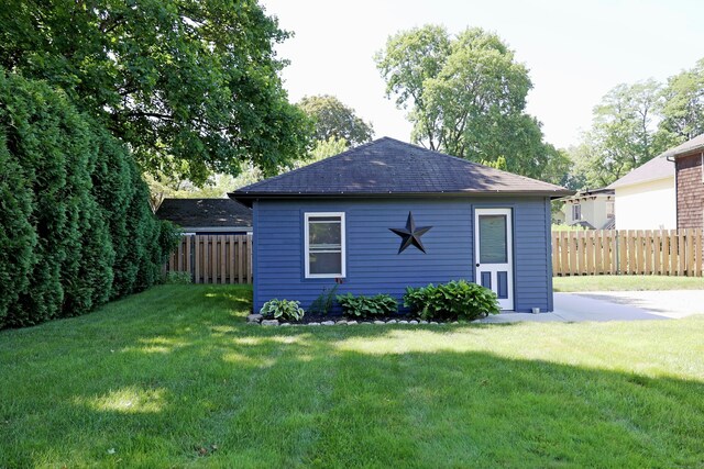 30 Elizabeth St, Bethel, CT 06801 - back of property with a fenced backyard and a shingled roof