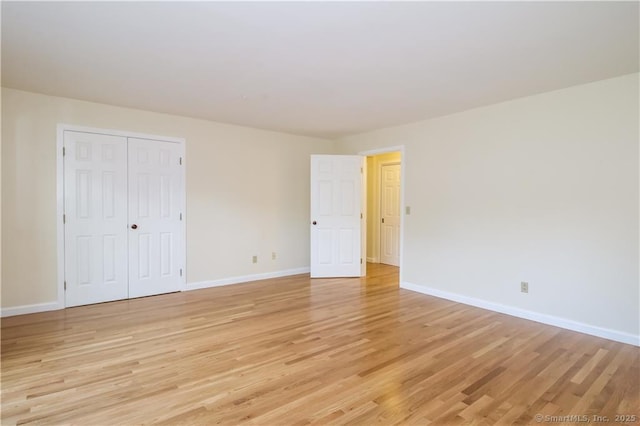 95 Audubon St Unit 339, New Haven, CT 06510 - unfurnished bedroom with light wood finished floors and a closet