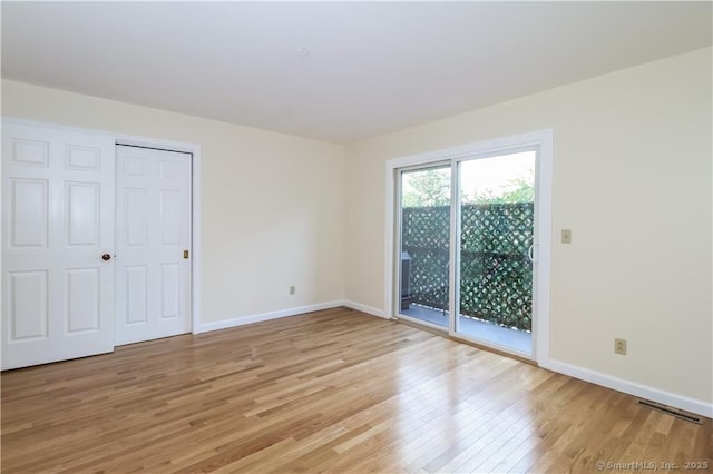 95 Audubon St Unit 339, New Haven, CT 06510 - unfurnished bedroom with light wood-style flooring, access to outside, and a closet