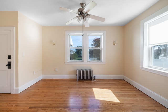15 Magnolia Ave, Bristol, CT 06010 - unfurnished room featuring radiator, light wood-style floors, and a ceiling fan