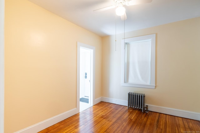 15 Magnolia Ave, Bristol, CT 06010 - spare room featuring radiator heating unit, wood-type flooring, and ceiling fan