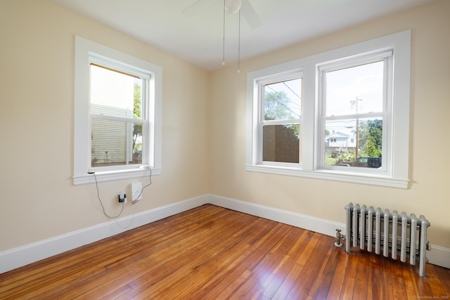 15 Magnolia Ave, Bristol, CT 06010 - spare room featuring radiator, plenty of natural light, hardwood / wood-style floors, and ceiling fan