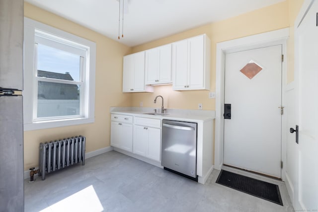 15 Magnolia Ave, Bristol, CT 06010 - kitchen with radiator, dishwasher, light countertops, and white cabinetry