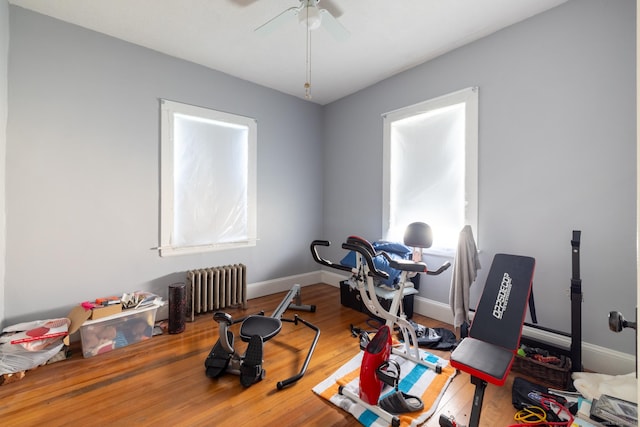 15 Magnolia Ave, Bristol, CT 06010 - exercise room with radiator heating unit, a ceiling fan, and wood finished floors