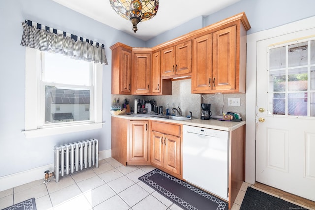 15 Magnolia Ave, Bristol, CT 06010 - kitchen featuring radiator heating unit, white dishwasher, light countertops, light tile patterned floors, and backsplash