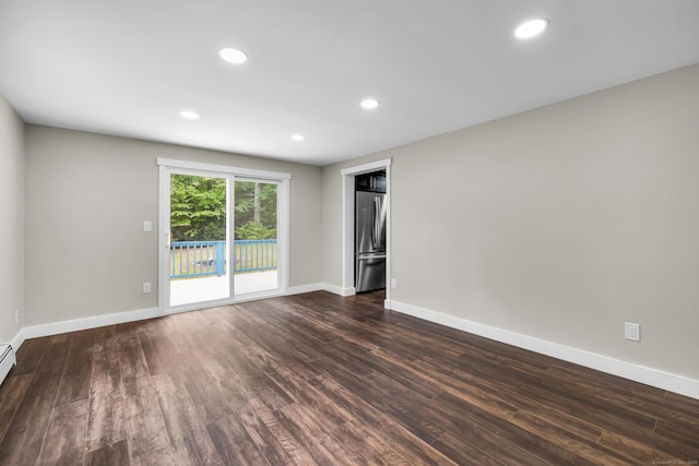216 Old Monson Rd, Stafford, CT 06076 - unfurnished room featuring dark wood-style flooring, recessed lighting, and a baseboard heating unit