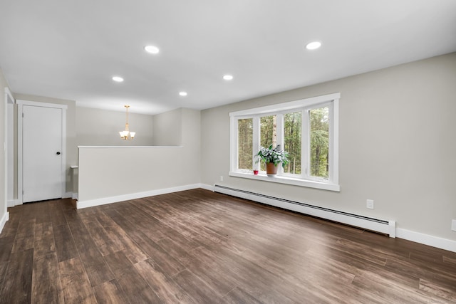 216 Old Monson Rd, Stafford, CT 06076 - spare room featuring a baseboard heating unit, a chandelier, wood finished floors, and recessed lighting