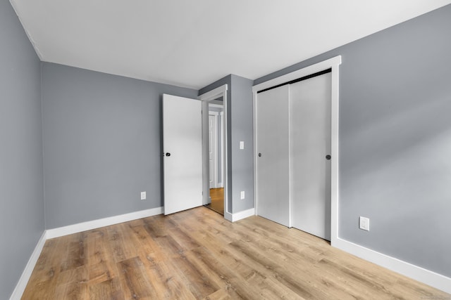 216 Old Monson Rd, Stafford, CT 06076 - unfurnished bedroom featuring wood finished floors and a closet