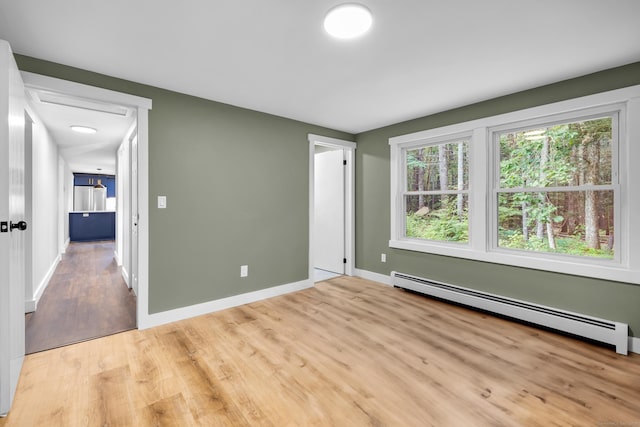 216 Old Monson Rd, Stafford, CT 06076 - spare room featuring a baseboard heating unit and light wood-type flooring