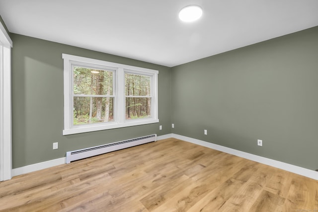 216 Old Monson Rd, Stafford, CT 06076 - spare room with a baseboard heating unit and light wood finished floors