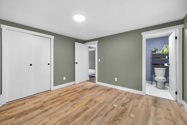 216 Old Monson Rd, Stafford, CT 06076 - unfurnished bedroom with light wood finished floors, a closet, and ensuite bath