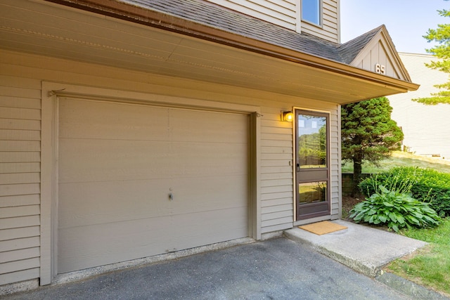 489 Wolcott St Unit 65, Bristol, CT 06010 - garage featuring asphalt driveway