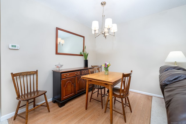 489 Wolcott St Unit 65, Bristol, CT 06010 - dining area featuring a chandelier and light wood finished floors