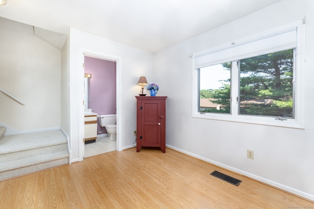 489 Wolcott St Unit 65, Bristol, CT 06010 - empty room with stairs and light wood-style floors