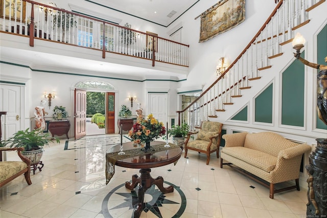 63 Turney Rd, Redding, CT 06896 - foyer with a towering ceiling, stairway, tile patterned flooring, and crown molding