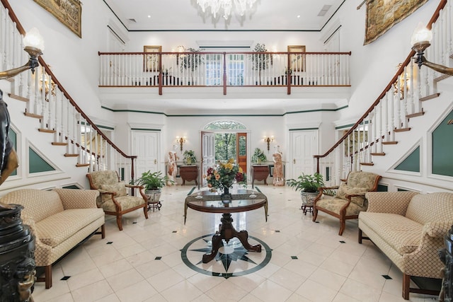 63 Turney Rd, Redding, CT 06896 - entrance foyer with stairs, a towering ceiling, a chandelier, crown molding, and tile patterned floors