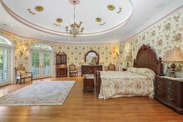 63 Turney Rd, Redding, CT 06896 - bedroom featuring wallpapered walls, access to outside, a chandelier, a wainscoted wall, and light wood finished floors
