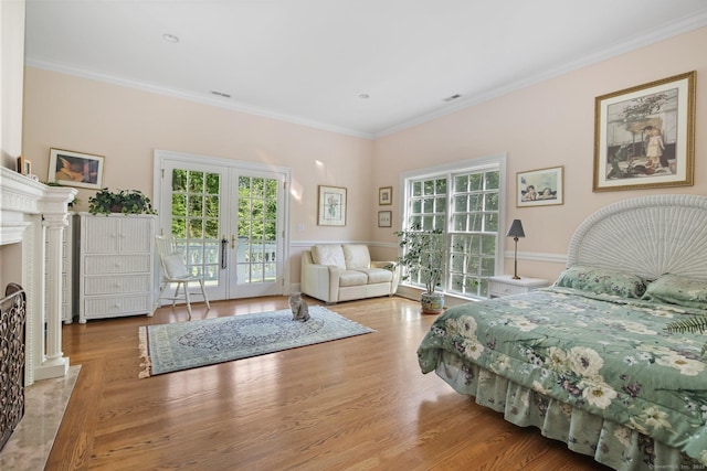 63 Turney Rd, Redding, CT 06896 - bedroom featuring multiple windows, access to exterior, french doors, crown molding, and wood finished floors