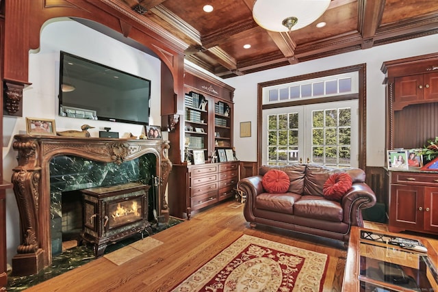 63 Turney Rd, Redding, CT 06896 - living room featuring coffered ceiling, a premium fireplace, wood finished floors, beamed ceiling, and a wainscoted wall
