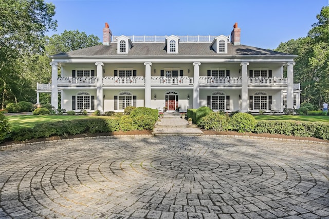 63 Turney Rd, Redding, CT 06896 - neoclassical home featuring a chimney, a balcony, and stucco siding