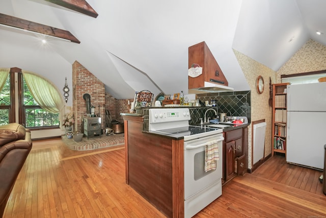 63 Turney Rd, Redding, CT 06896 - kitchen with white appliances, open floor plan, a wood stove, and dark countertops
