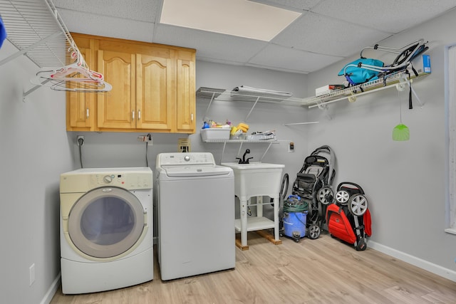 202 Plainville Ave, Farmington, CT 06085 - laundry area with washer and dryer, cabinet space, and light wood finished floors
