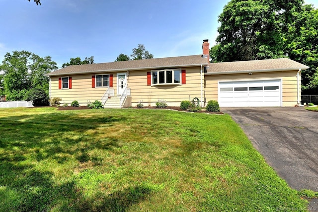 754 Riverside Dr, Orange, CT 06477 - ranch-style home featuring asphalt driveway, a chimney, an attached garage, and a front yard