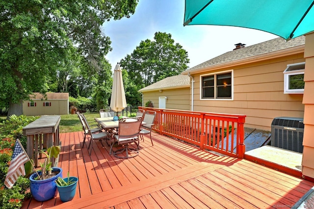 754 Riverside Dr, Orange, CT 06477 - wooden deck featuring outdoor dining area and a shed