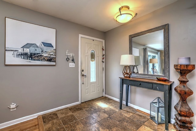 754 Riverside Dr, Orange, CT 06477 - entryway with baseboards and dark stone finish flooring