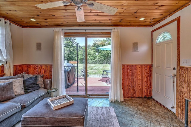 754 Riverside Dr, Orange, CT 06477 - living room featuring wood ceiling, wainscoting, wood walls, and ceiling fan