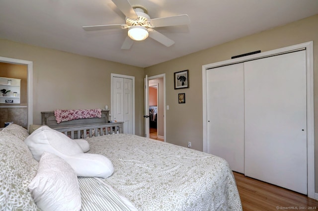 754 Riverside Dr, Orange, CT 06477 - bedroom with two closets, wood finished floors, and ceiling fan