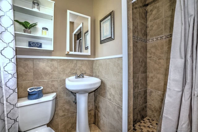 754 Riverside Dr, Orange, CT 06477 - full bathroom with a shower stall, a wainscoted wall, and tile walls