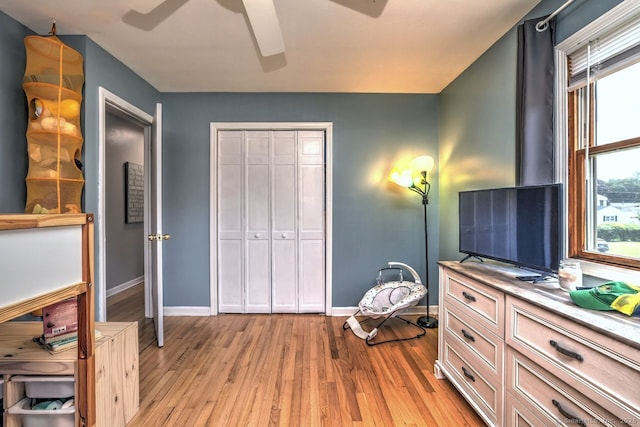 754 Riverside Dr, Orange, CT 06477 - bedroom featuring light wood finished floors, multiple windows, a closet, and ceiling fan
