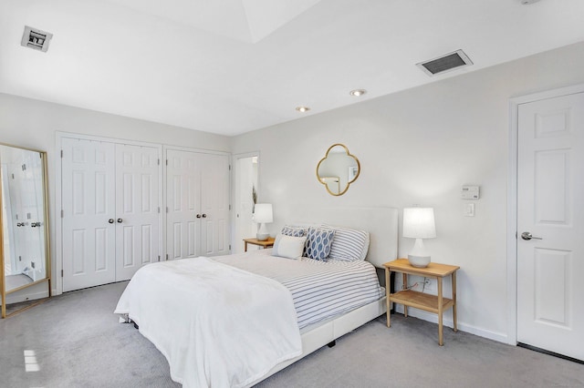 118 Grove St Apt 7, Stamford, CT 06901 - carpeted bedroom featuring two closets and baseboards
